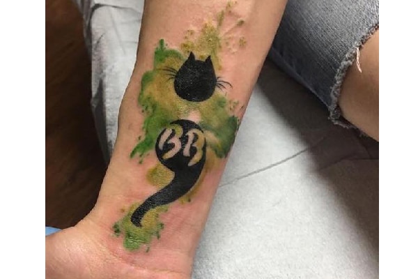 Aidyn B.'s cat tattoo.