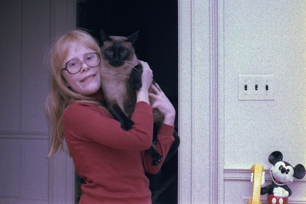 First daughter Amy Carter with her Siamese cat Misty Malarky Ying Yang.