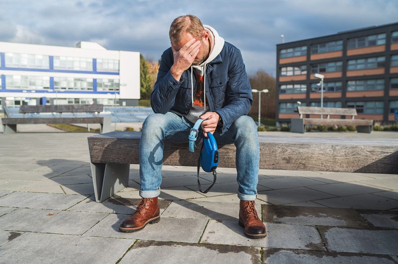 man grieving because of loss pet