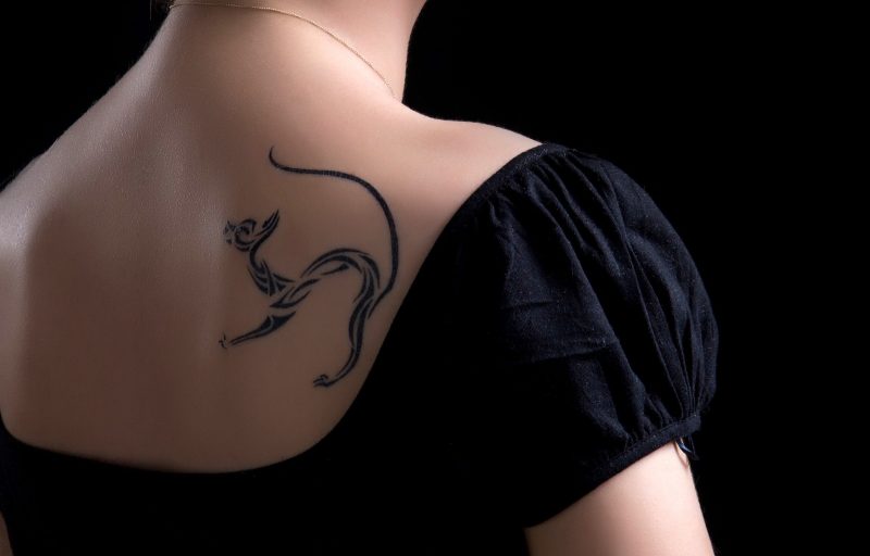 Young Woman with cat tattoo