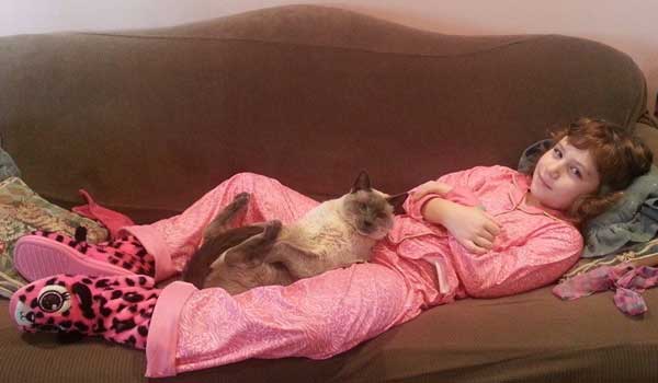 Oliver and my daughter enjoying some quality time together. (Photo courtesy Debbie De Louise.)