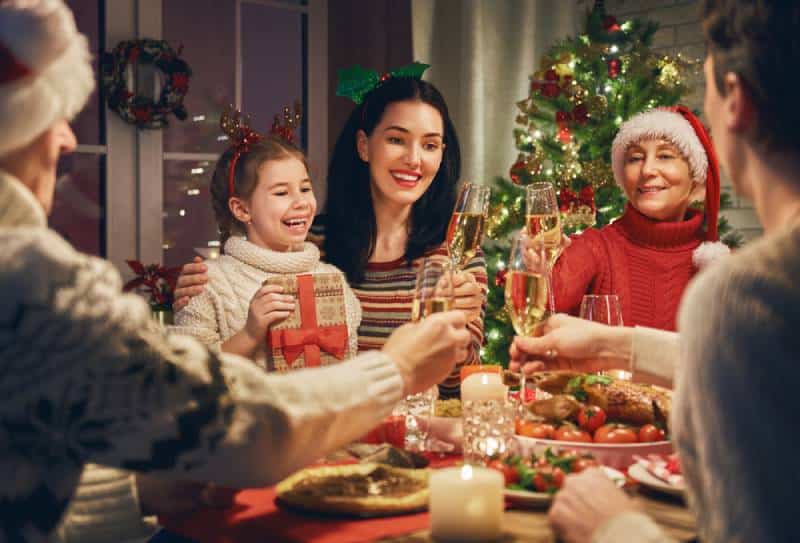 a christmas dinner party celebrated by a family