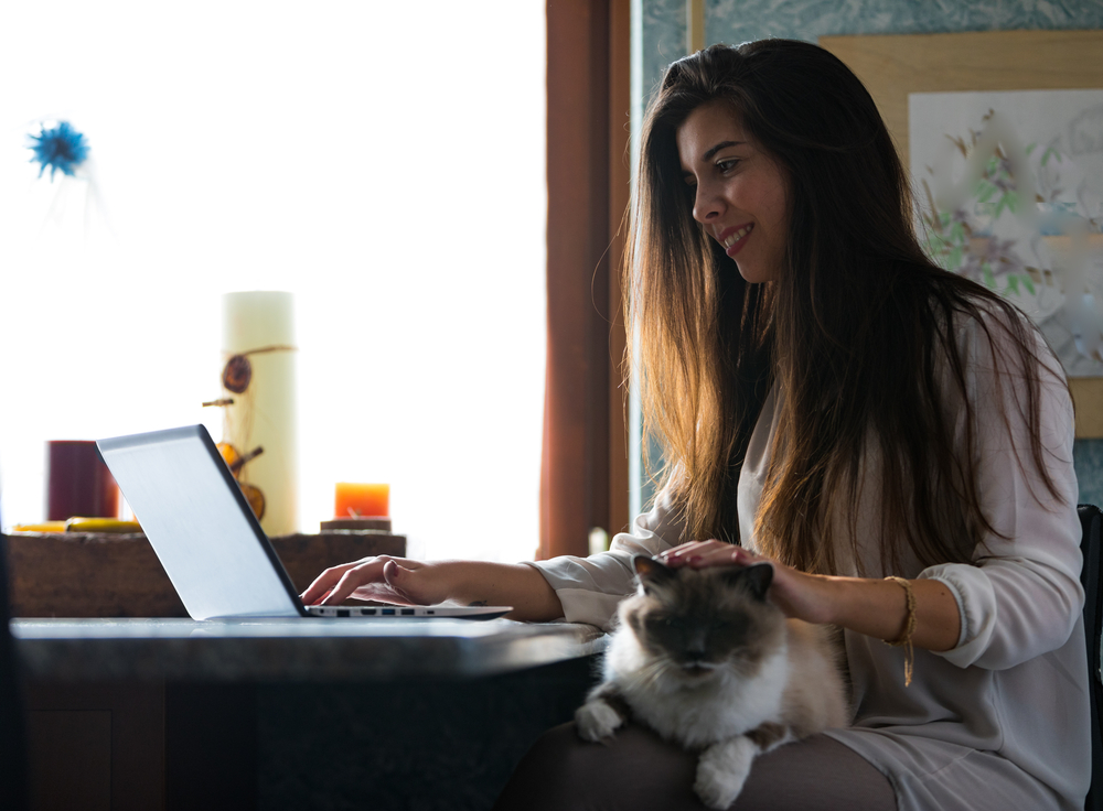 young woman working from home on a laptop