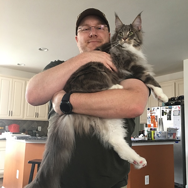 “Here's my hubby Mark with our Maine Coon Quincy.” -Submitted via email by Eileen Melnick