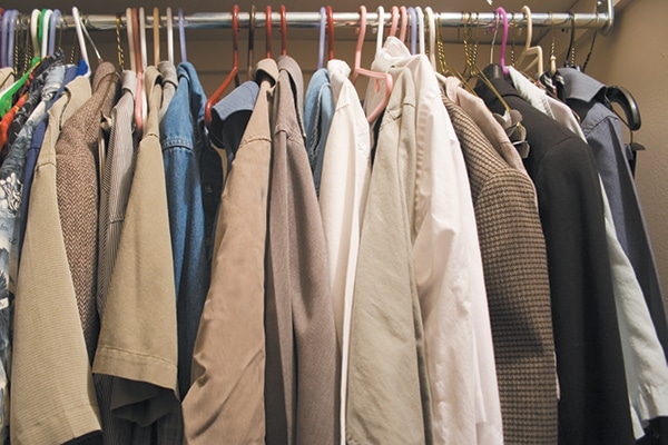 A closet full of coats. 