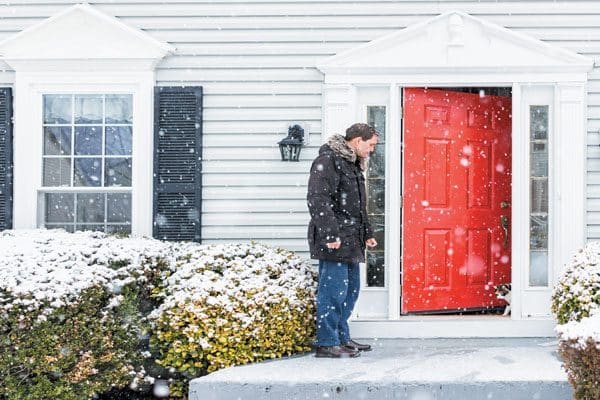 The front door is an escape from stress for your cat so be sure it is closed. Photography ©karamysh | Getty Images.