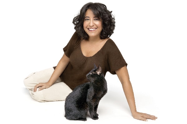 Gwen Cooper (pictured with Homer), is a New York Times best-selling author and helps educate people about blind cats.
