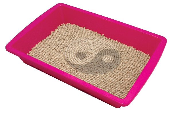 A litter box with ying yang design. 