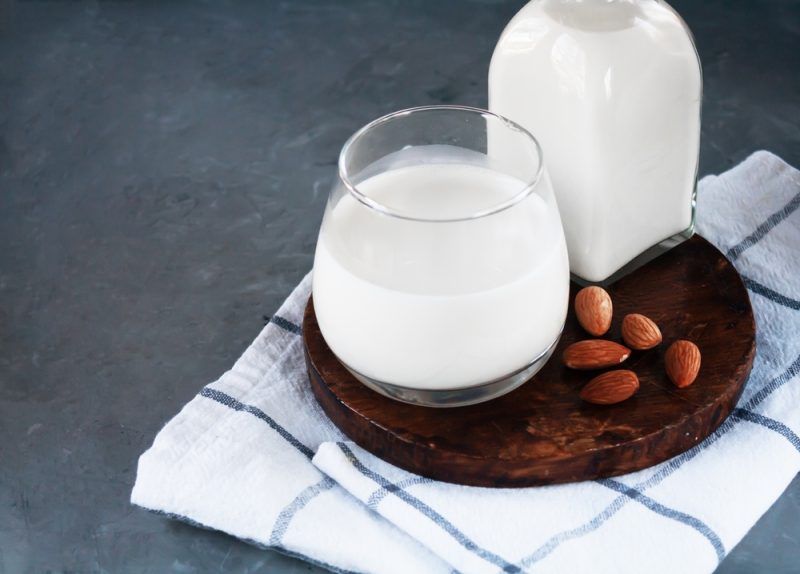 Almond milk glass served on a table