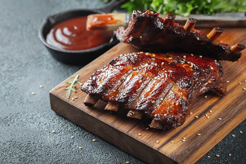 Closeup of pork ribs grilled with BBQ sauce and caramelized in honey