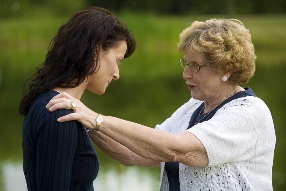 Old Lady talking to a sad woman