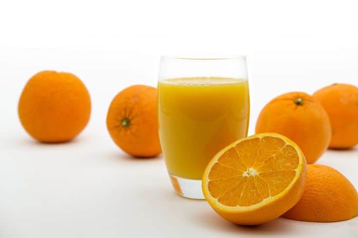 Orange juice on white background