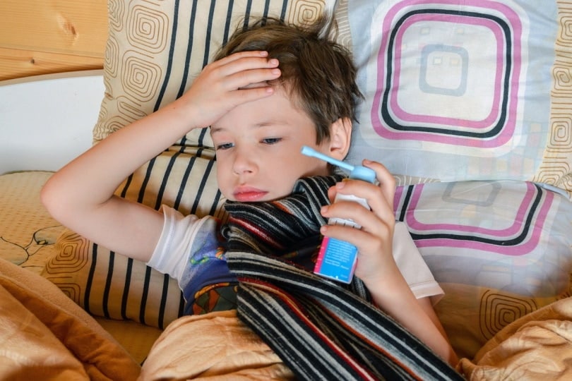 Young boy with inhaler for asthma