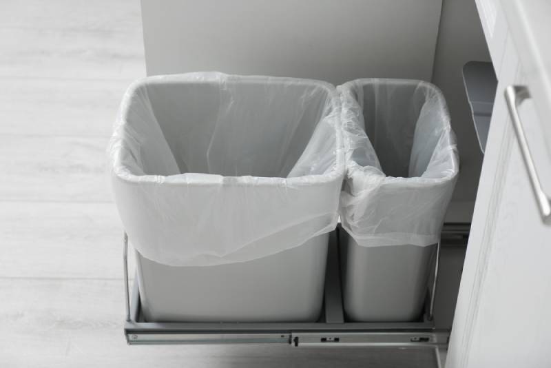 a pull out trash storage cabinet