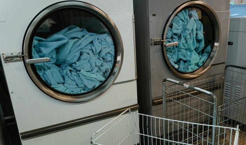 blue fabric in white and grey washing machine