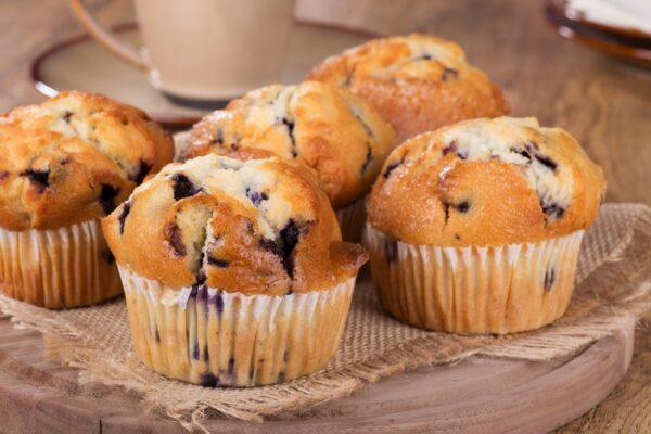 blueberry muffins on wooden platter