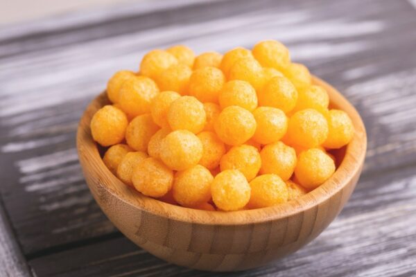 cheese puffs balls in wooden bowl