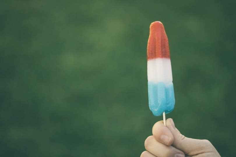 colorful popsicle held up