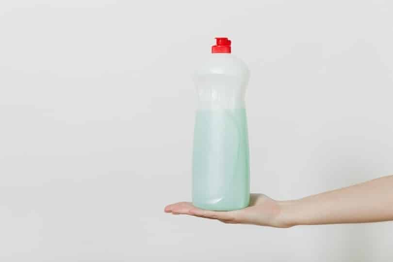 dishwashing detergent dispenser on a womans hand