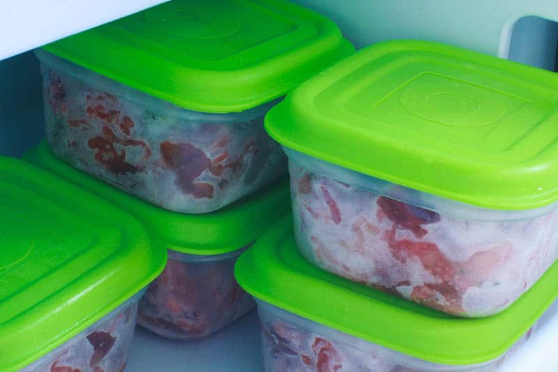homemade cat food on containers inside the freezer