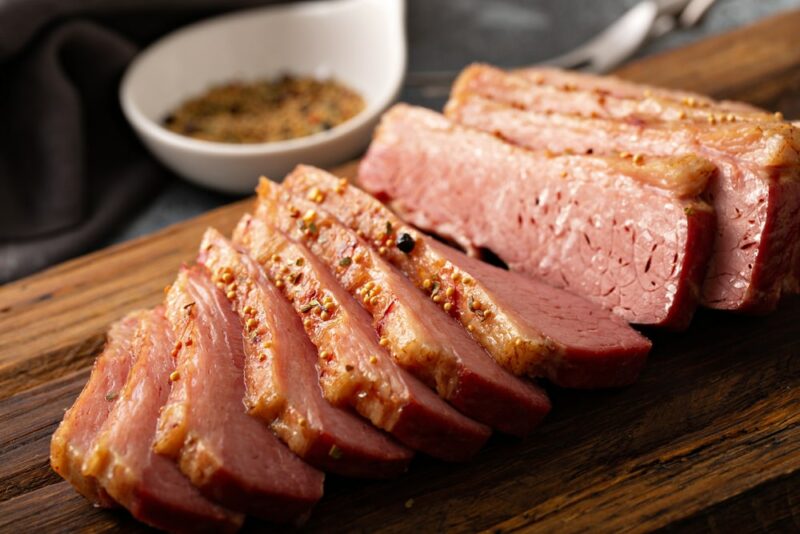 homemade corned beef sliced on cutting board