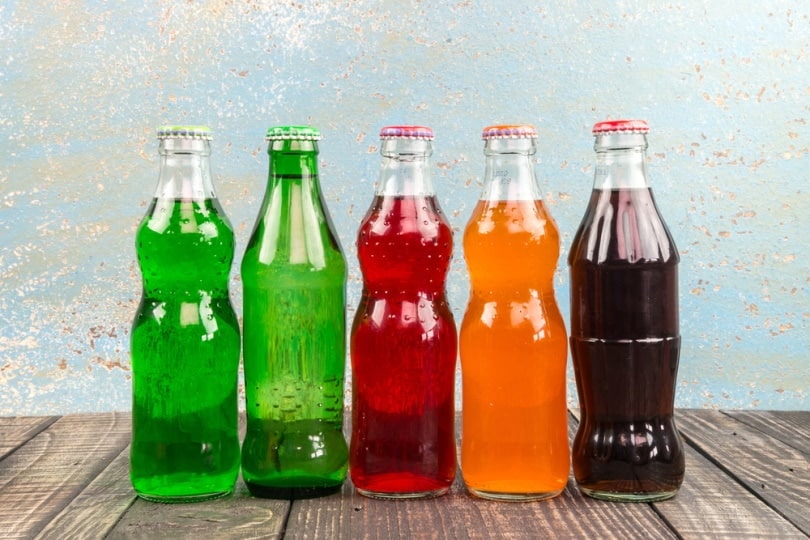 variety of soda in the bottles