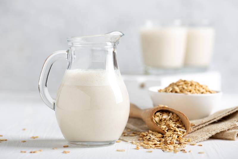 vegan oat milk in a glass pitcher