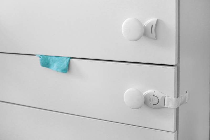 white drawers with child proof locks