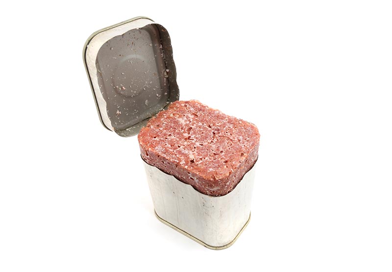 Corned Beef in Tin over white background
