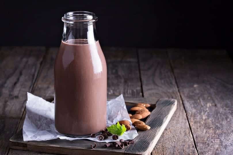 Homemade almond chocolate milk in a bottle