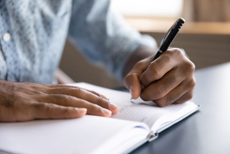 Man writing in a journal