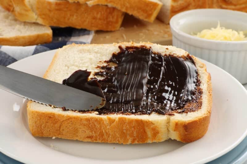 Spreading the iconic Australian spread vegemite on to a slice of fresh bread