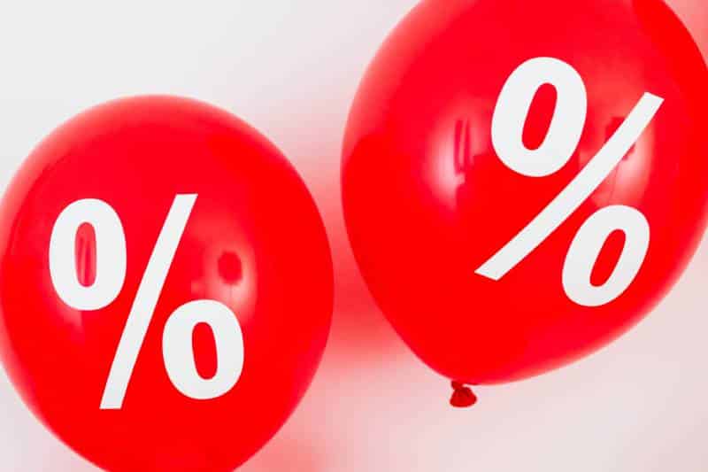 Two Red Balloons With Percentage Symbols or discount