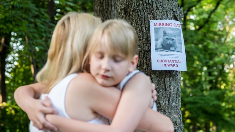 Woman hugging daughter who lost a cat