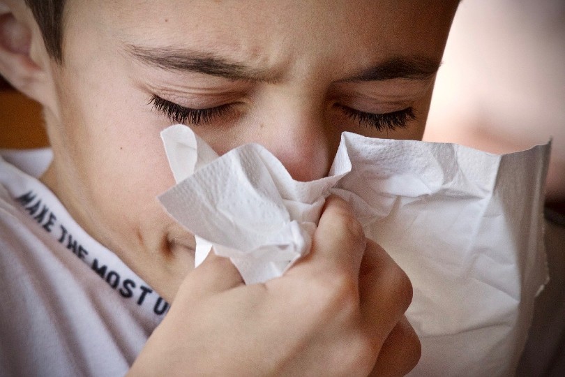 a kid sneezing