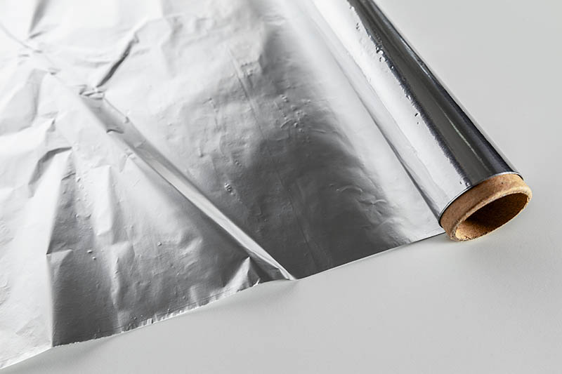 a roll of aluminum foil on countertop