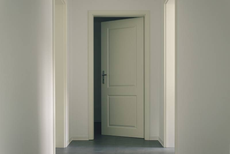 a slightly open white door