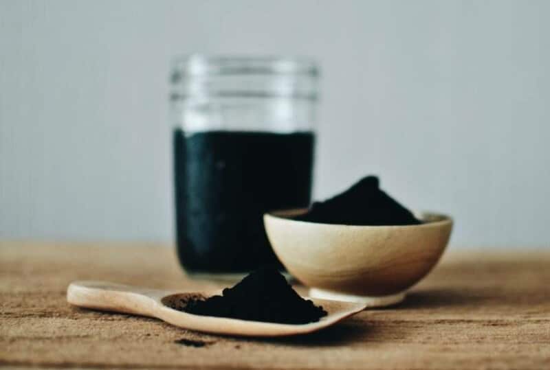 activated charcoal on wooden table