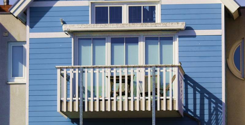 blue house with balcony