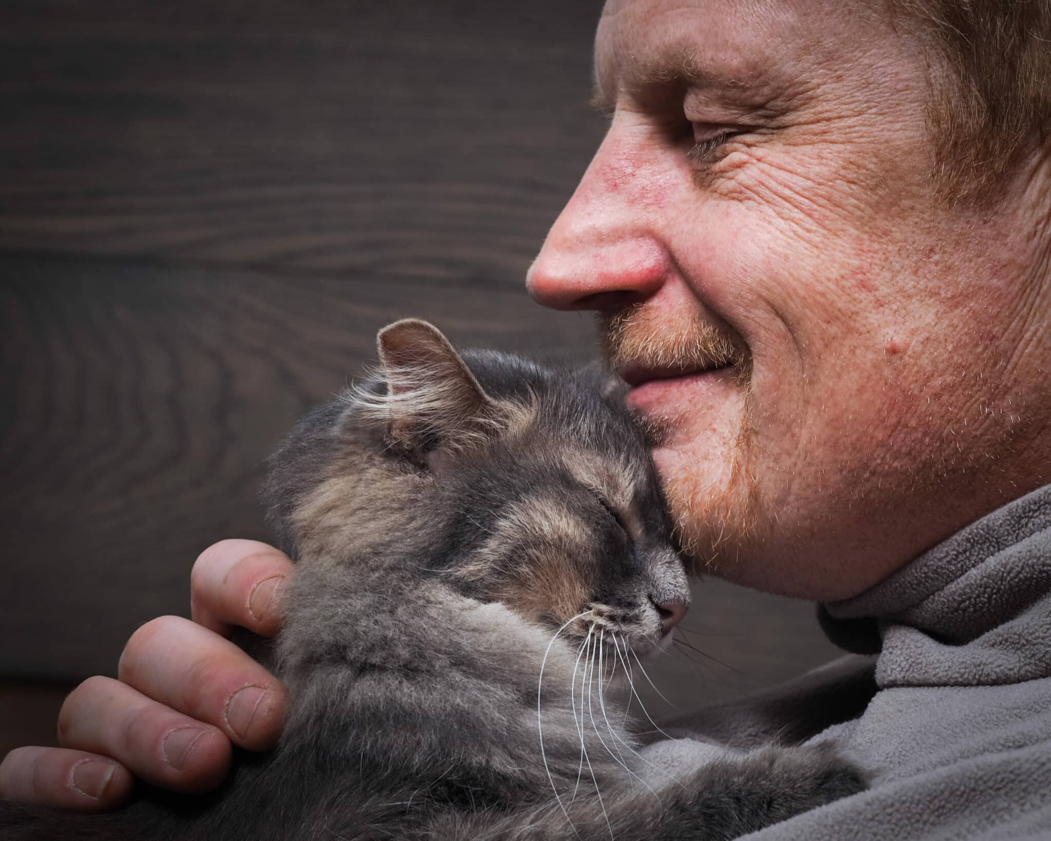 cat in man's chin