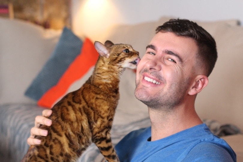 cat-licking-owners-face