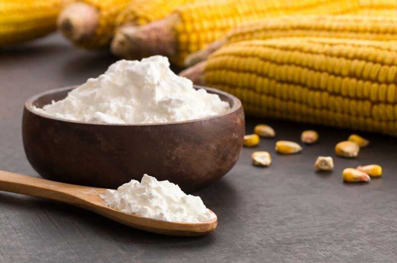 cornstarch in a bowl beside a corn