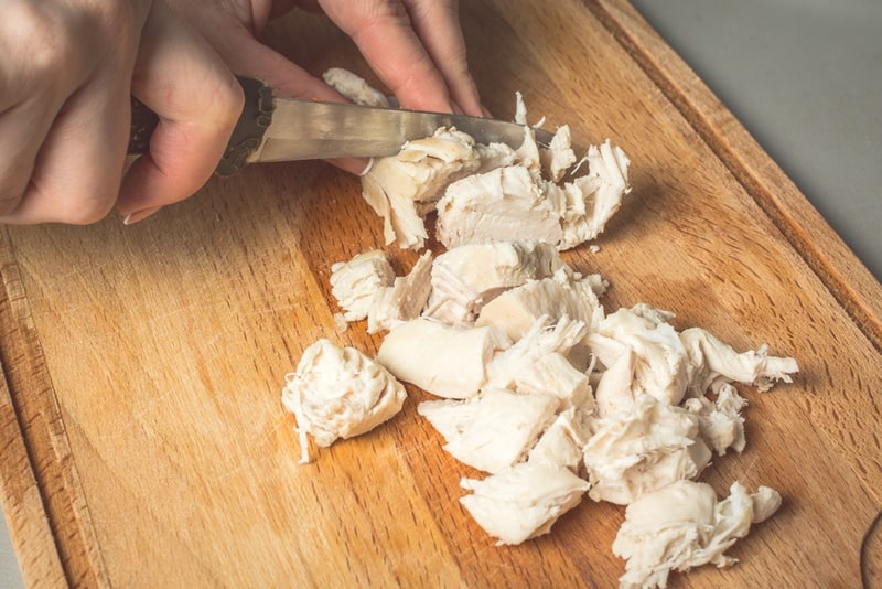cutting boiled chicken