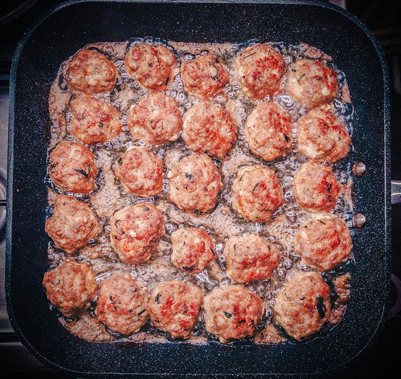 frying meatballs in the pan