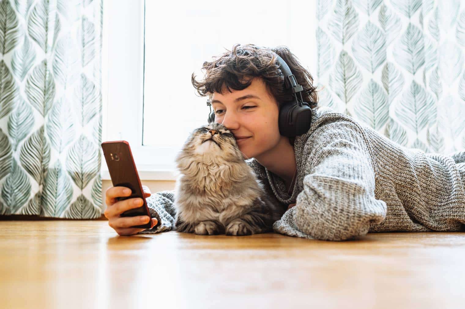 girl in headphones with your cat