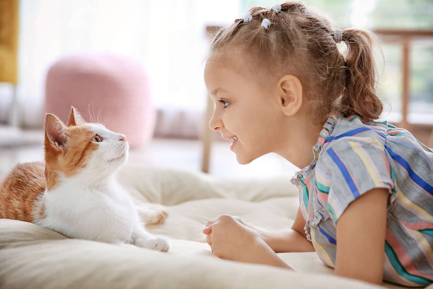 Girl talking to cat