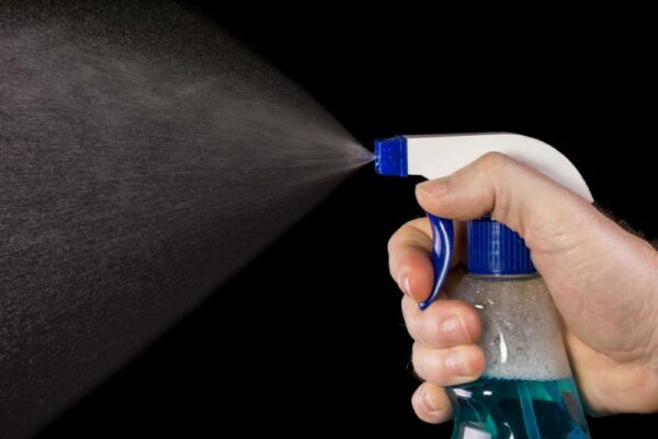 man-spraying-using-bottle-spray_