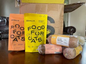 smalls freeze-dried raw and human-grade fresh cat food on a table