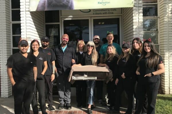 Staff photo fixnation with Cloud the 250,000th kitty