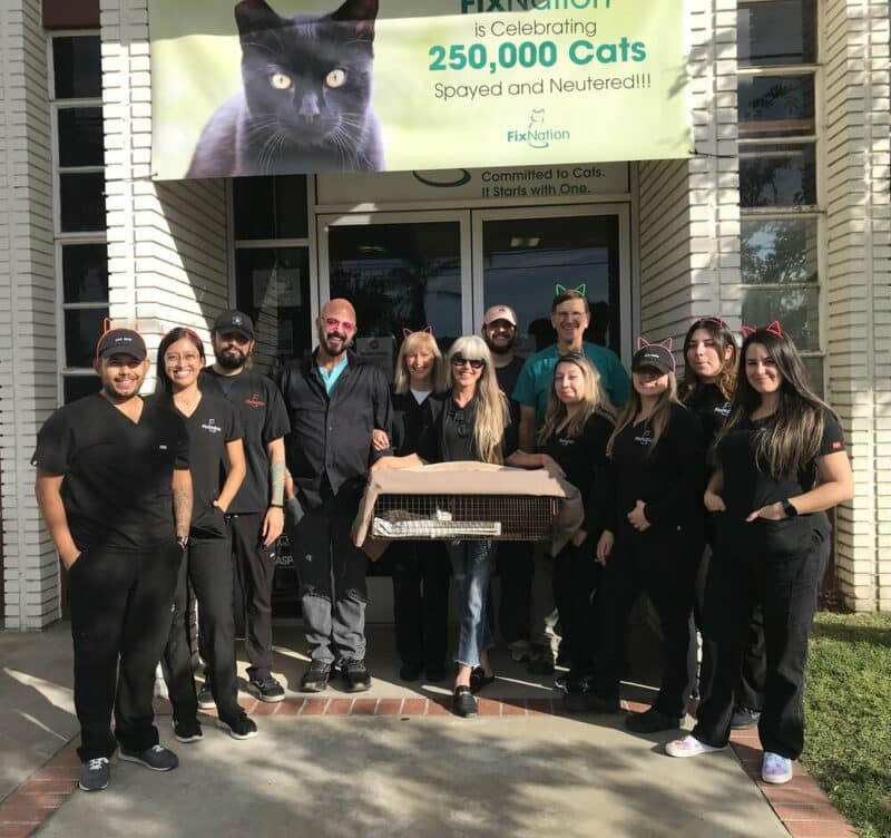 Staff photo fixnation with Cloud the 250,000th kitty